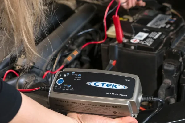 Multi-stage battery maintainer connected to a car battery via a ring terminal pigtail