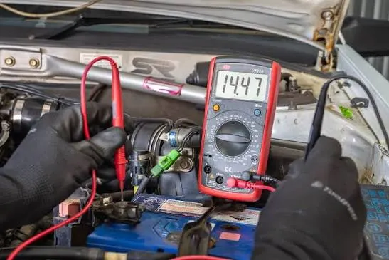 Battery Tender vs. Trickle Charger vs. Disconnecting the Battery 2 Multimeter showing resting voltage across a car battery after winter storage